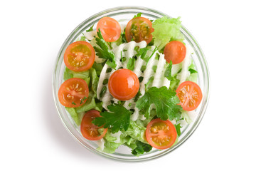 Vegetables salad in a glass salad bowl