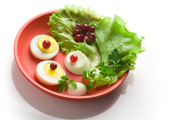 Egg  salad on a red round dish