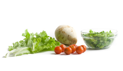 Fresh vegetables for salad over white background