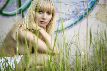 blonde nude girl sitting behind grass © impressed-media.de