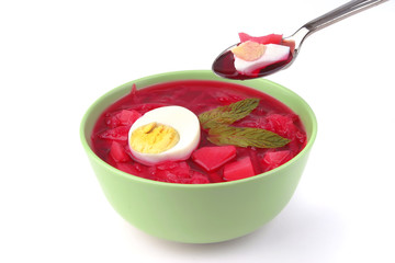 red vegetable soup over white