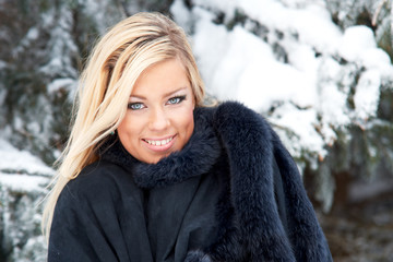 Woman in winter forest