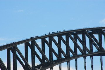 People walking across a bridge