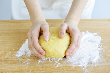 Hands kneading dough - Powered by Adobe