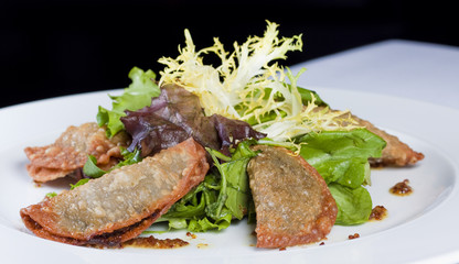 fried dumblings with greens