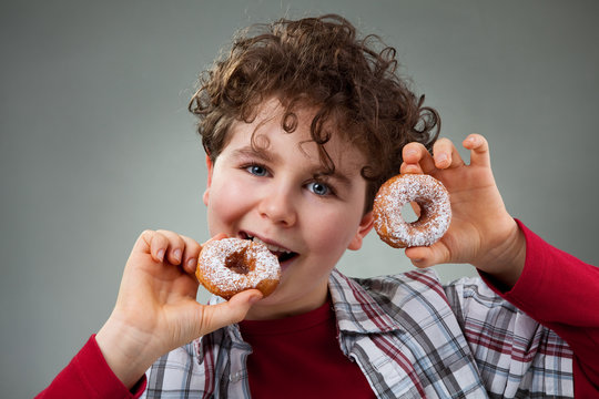 Boy Eating Donut