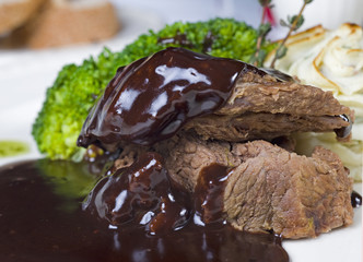 Camel steak in chocolate sauce