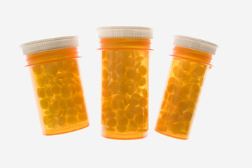 Three Yellow Plastic Medicine Bottles. Isolated