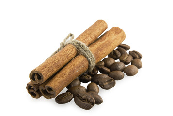 Cinnamon sticks to the left on coffee beans