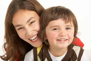 Studio Portrait Of Brother And Sister