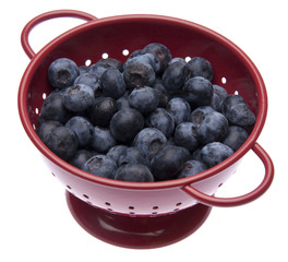 Fresh Blueberries in a Bright Red Colander
