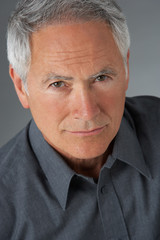 Studio Portrait Of Senior Man