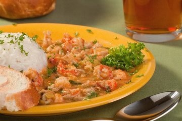 Plate of delicious thick cajun crawfish etouffee with rice