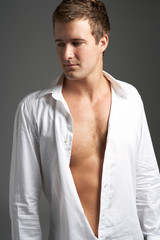 Obraz premium Studio Portrait Of Young Man Wearing Open Shirt