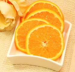 Foto op Plexiglas anti-reflex Plakjes fruit Oranje