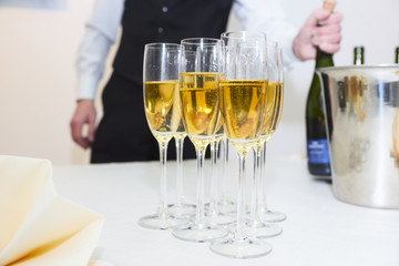 Waiter serving champagne