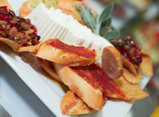 Plate with snacks on banquet table