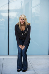 Obraz premium Attractive Blond Woman Standing and Smiling