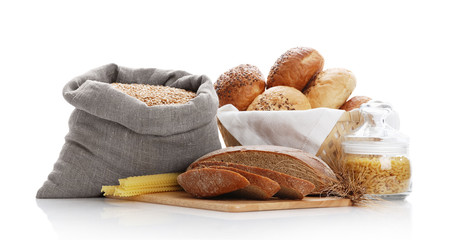 Heap of various bread, bag with wheat and macaroni