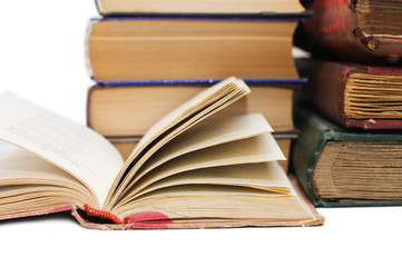 Pile of old books on white background