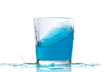 Blue liquid in a low glass