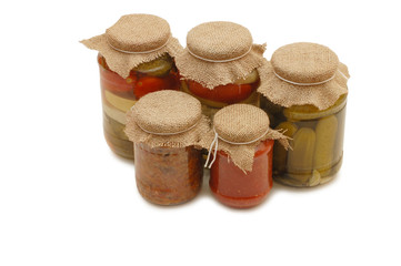 Glass jars with tinned vegetables isolated