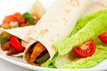 Spicy mexican fajita wraps on a white background