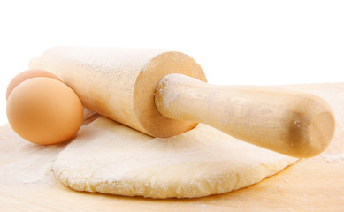 Fototapeta na wymiar Pastry, flour, milk and eggs on wooden background