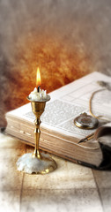 Fototapeta na wymiar Candle with book
