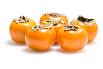 Persimmons. Isolated on white background.