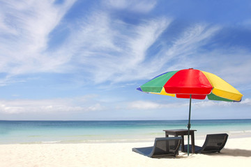 umbrella and chairs on sand beach
