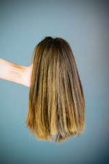 Fototapeta premium Hair wig against the background