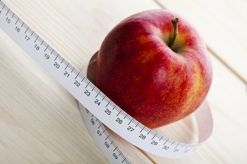 Apple and measurement tape
