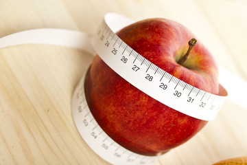 Tape measure and apple