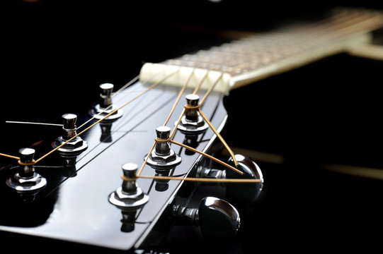 neck of black guitar