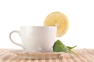 full cup of tea with lemon