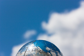 globe against cloudy sky