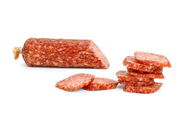 Half of salami sausage and slices near