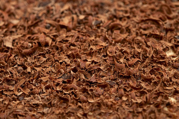 .Grated 100 percent cacao dark chocolate background, full-frame,