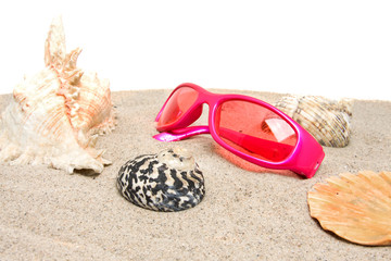 Pink sunglasses on the beach