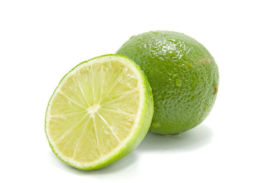 fresh juicy green lime over white background