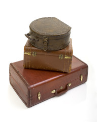 pile of three vintage suitcase