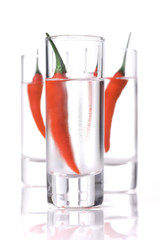 Three Glass of Vodka with red chili pepper