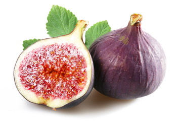 Figs with cut fruit and leaves on a white background