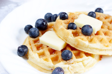 Waffles with blue berries and butter