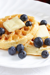 plate of waffles and blueberries