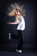 woman modern dancer against black background