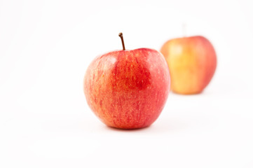 Two red Apples, one in focus