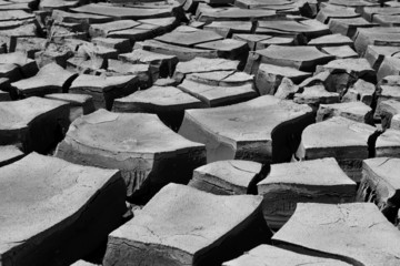 desertClose up macro of deep cracks in dried up soil. Natural disaster, climate change, global...