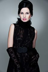 alluring woman in black dress and gloves